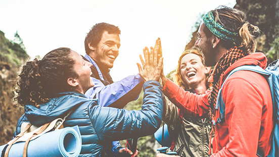 A group of diverse travelers engaging in meaningful, community-based activities, such as cultural exchanges or eco-tourism.